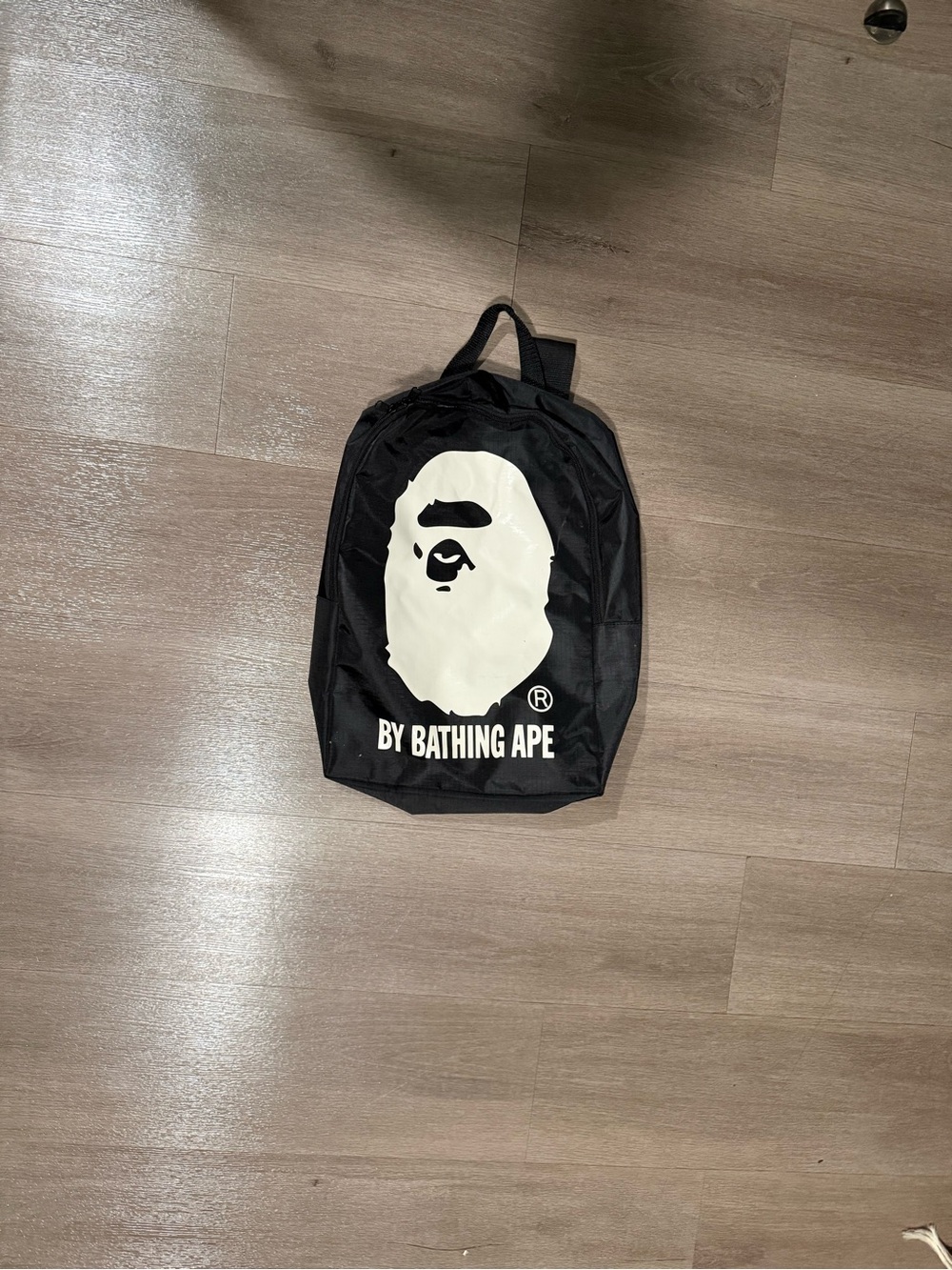 BAPE A Bathing Ape Ape Head Mini Backpack Black White By Bathing Ape Logo